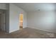 A bedroom with a neutral palette leads to an ensuite bathroom at 9730 Tea Garden Dr, Gastonia, NC 28056