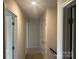 Upstairs hallway featuring neutral walls and carpeted floors at 9730 Tea Garden Dr, Gastonia, NC 28056