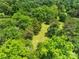 Beautiful property with lush green trees, creating a private and serene setting at 9929 Kerns Rd, Huntersville, NC 28078
