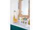 Charming bathroom with framed mirror, colorful wallpaper, gold fixtures, and marble countertop at 9929 Kerns Rd, Huntersville, NC 28078