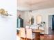 Bright dining room with statement lighting fixture and dining table at 9929 Kerns Rd, Huntersville, NC 28078