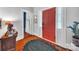 Entryway featuring a colorful door and a glimpse into the home's interior at 9929 Kerns Rd, Huntersville, NC 28078