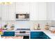Beautiful kitchen features white cabinets, stainless steel appliances, and a cooktop stove at 9929 Kerns Rd, Huntersville, NC 28078