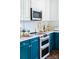 Well-lit kitchen features white cabinets and stainless steel appliances at 9929 Kerns Rd, Huntersville, NC 28078