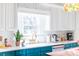 Kitchen sink area with white counter tops and white backsplash at 9929 Kerns Rd, Huntersville, NC 28078