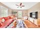 Cozy living room with a comfortable couch, colorful rug, and ample natural light at 9929 Kerns Rd, Huntersville, NC 28078