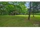 Expansive lawn featuring a playground for outdoor enjoyment and activities on the property at 9929 Kerns Rd, Huntersville, NC 28078