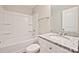Bathroom featuring a bathtub with shower and a granite vanity top at 1028 Gibson St, Albemarle, NC 28001