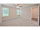 Inviting bedroom with plush carpeting and sun-filled windows offers relaxation and comfort at 1028 Gibson St, Albemarle, NC 28001
