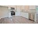 Modern kitchen with stainless steel appliances and granite counters provides form and function at 1028 Gibson St, Albemarle, NC 28001