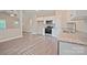 Well-lit kitchen with stainless appliances, granite counters, and open-concept design at 1028 Gibson St, Albemarle, NC 28001