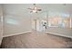 Open-concept living area with gray floors flowing into the modern kitchen space at 1028 Gibson St, Albemarle, NC 28001
