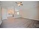 Spacious living room featuring vaulted ceilings and modern gray flooring at 1028 Gibson St, Albemarle, NC 28001