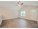 Open-concept living area featuring gray flooring and a partial view of the front door at 1028 Gibson St, Albemarle, NC 28001