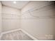 Spacious walk-in closet with ample shelving offers great storage solutions at 1028 Gibson St, Albemarle, NC 28001