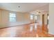 Large bedroom with ceiling fan, tile flooring, mirrored closet, and multiple windows at 105 Hopewell Church Rd, Shelby, NC 28152