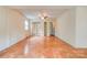 Large bedroom with ceiling fan, tile flooring, mirrored closet, and multiple windows at 105 Hopewell Church Rd, Shelby, NC 28152