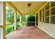 Inviting covered front porch with wood flooring and white railings at 105 Hopewell Church Rd, Shelby, NC 28152
