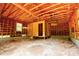 A rustic interior showcases a framed ceiling and walls, revealing the construction and potential of the garage at 105 Hopewell Church Rd, Shelby, NC 28152