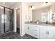 Modern bathroom with gray tile shower, double vanity, and stylish black hardware at 1100 Herrons Ferry Rd, Rock Hill, SC 29730