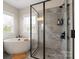 Luxurious bathroom features a soaking tub, glass-enclosed shower, and stylish tile work at 1100 Herrons Ferry Rd, Rock Hill, SC 29730