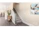 Hallway featuring wood-look floors, staircase, and stylish decor at 1100 Herrons Ferry Rd, Rock Hill, SC 29730