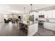 Open concept kitchen with a large island and seating, stainless appliances, and open living area at 1100 Herrons Ferry Rd, Rock Hill, SC 29730