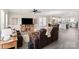 Spacious living room with hardwood floors, large TV, and open to dining area at 1100 Herrons Ferry Rd, Rock Hill, SC 29730