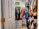 Walk-in closet with ample storage space and organized clothing racks, providing plenty of room for apparel at 1209 Danielle Downs Se Ct, Concord, NC 28025
