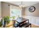 Cozy dining area with wood flooring and a large window providing natural light at 1209 Danielle Downs Se Ct, Concord, NC 28025