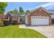 Well maintained single Gathering home showcasing brick facade and mature landscaping at 1209 Danielle Downs Se Ct, Concord, NC 28025