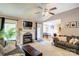 Comfortable living space with fireplace, connecting to the dining area and kitchen at 1209 Danielle Downs Se Ct, Concord, NC 28025