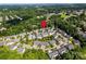 Aerial view of a residential area with mature trees and well-maintained homes at 128 Aztec Cir, Mooresville, NC 28117
