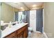Updated bathroom featuring a single sink vanity and stylish shower curtain at 128 Aztec Cir, Mooresville, NC 28117