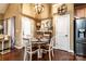 Inviting dining area with a rustic chandelier and a fun, decorative clock at 128 Aztec Cir, Mooresville, NC 28117