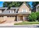Charming two-story home with a covered front porch and attached garage at 128 Aztec Cir, Mooresville, NC 28117