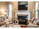 Close-up view of the fireplace, with decorative mantel and hearth at 128 Aztec Cir, Mooresville, NC 28117