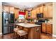 Well-equipped kitchen with granite countertops, ample cabinet space, and stainless steel refrigerator at 128 Aztec Cir, Mooresville, NC 28117