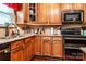 Functional kitchen with modern appliances, granite countertops, and attractive cabinetry at 128 Aztec Cir, Mooresville, NC 28117