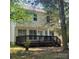 A two-story home with a backyard deck, perfect for outdoor entertaining and relaxation at 13039 Peacock Ln, Charlotte, NC 28215