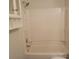 A full bathroom features storage shelves and shower over tub combination at 13039 Peacock Ln, Charlotte, NC 28215