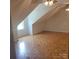 Spacious bedroom featuring parquet flooring, natural light, and a ceiling fan at 13039 Peacock Ln, Charlotte, NC 28215
