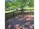 Wooden deck in a backyard setting, perfect for outdoor relaxation and entertaining at 13039 Peacock Ln, Charlotte, NC 28215