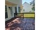 Exterior view of a wooden deck with access to the house and backyard at 13039 Peacock Ln, Charlotte, NC 28215