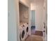 A laundry room features a newer washer and dryer in a closet space ready for use at 13039 Peacock Ln, Charlotte, NC 28215