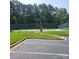 Community tennis courts surrounded by trees and green lawns at 13039 Peacock Ln, Charlotte, NC 28215