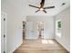 Bedroom featuring neutral walls, ceiling fan, wood-look floors, and two closets at 1407 7Th St # 4, Statesville, NC 28677