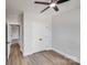 Spacious bedroom with hardwood floors, ample closet space, and a modern ceiling fan at 1407 7Th St # 4, Statesville, NC 28677