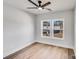Bright bedroom with hardwood floors, a modern ceiling fan, and dual windows at 1407 7Th St # 4, Statesville, NC 28677