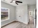 Cozy bedroom with hardwood floors, a ceiling fan, and a view to the outdoors at 1407 7Th St # 4, Statesville, NC 28677